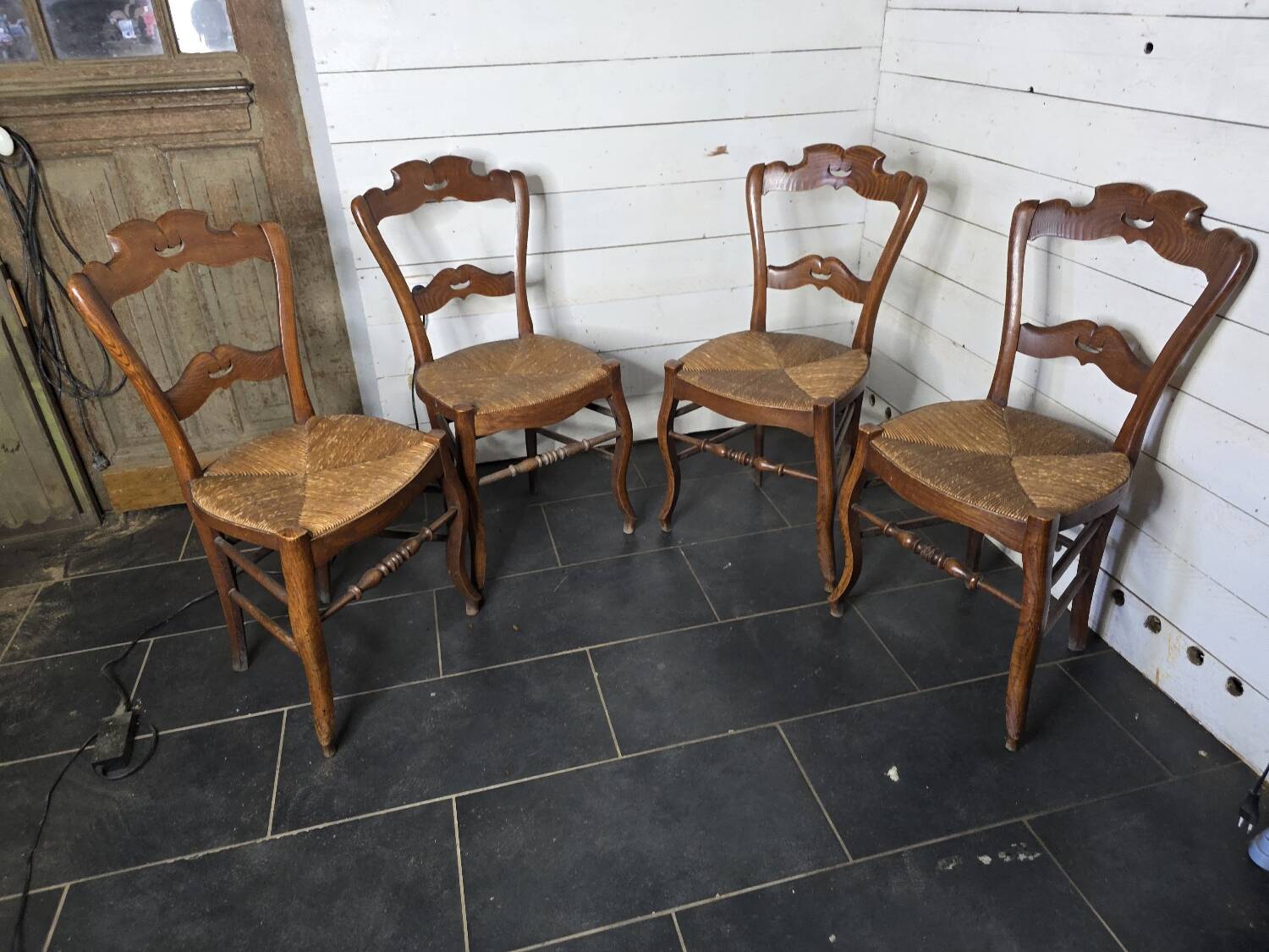 4 old straw chairs