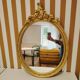 Oval gold mirror