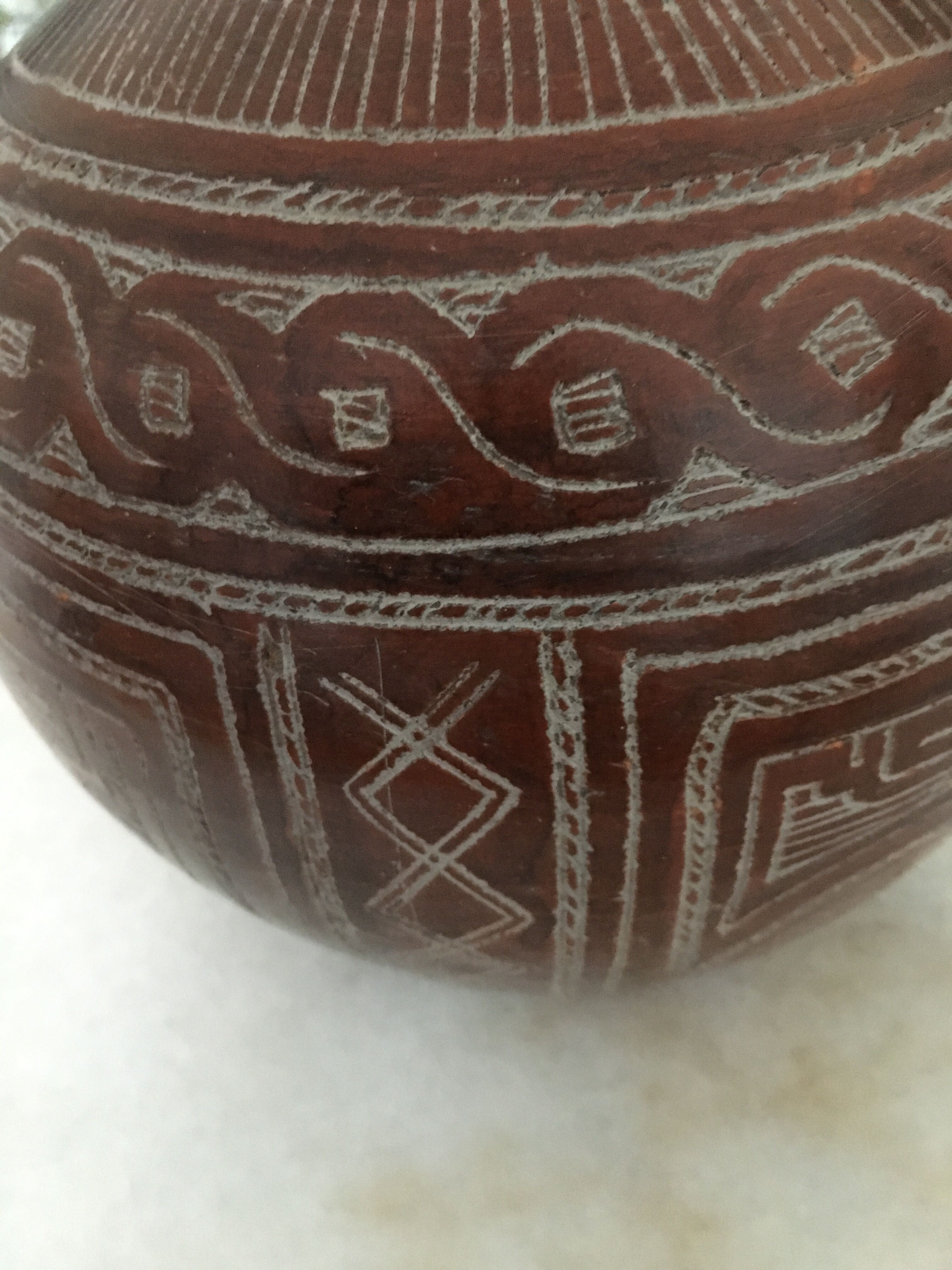 Vase in earth baked ethnic graphic patterns