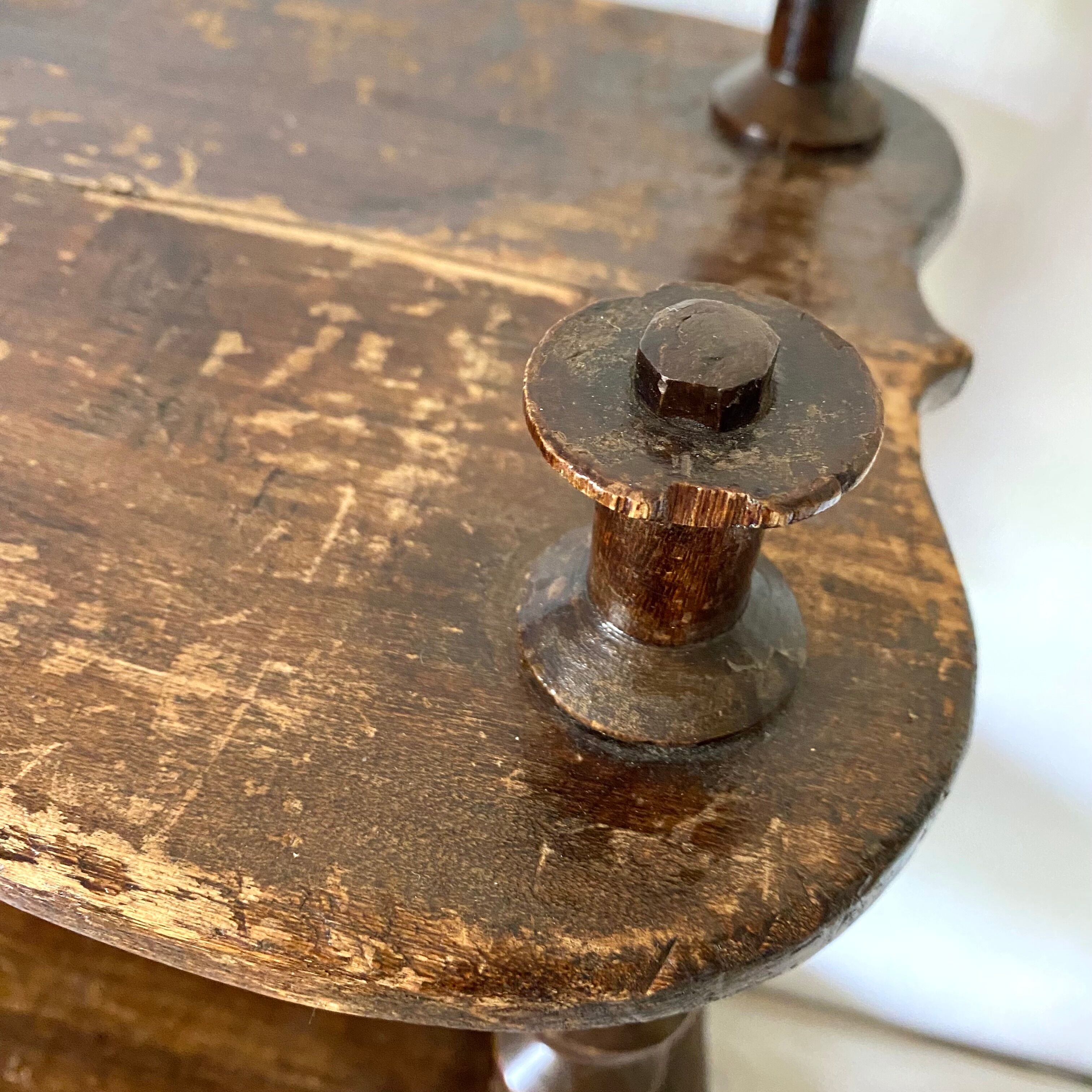 Old shelf in turned wood like reels
