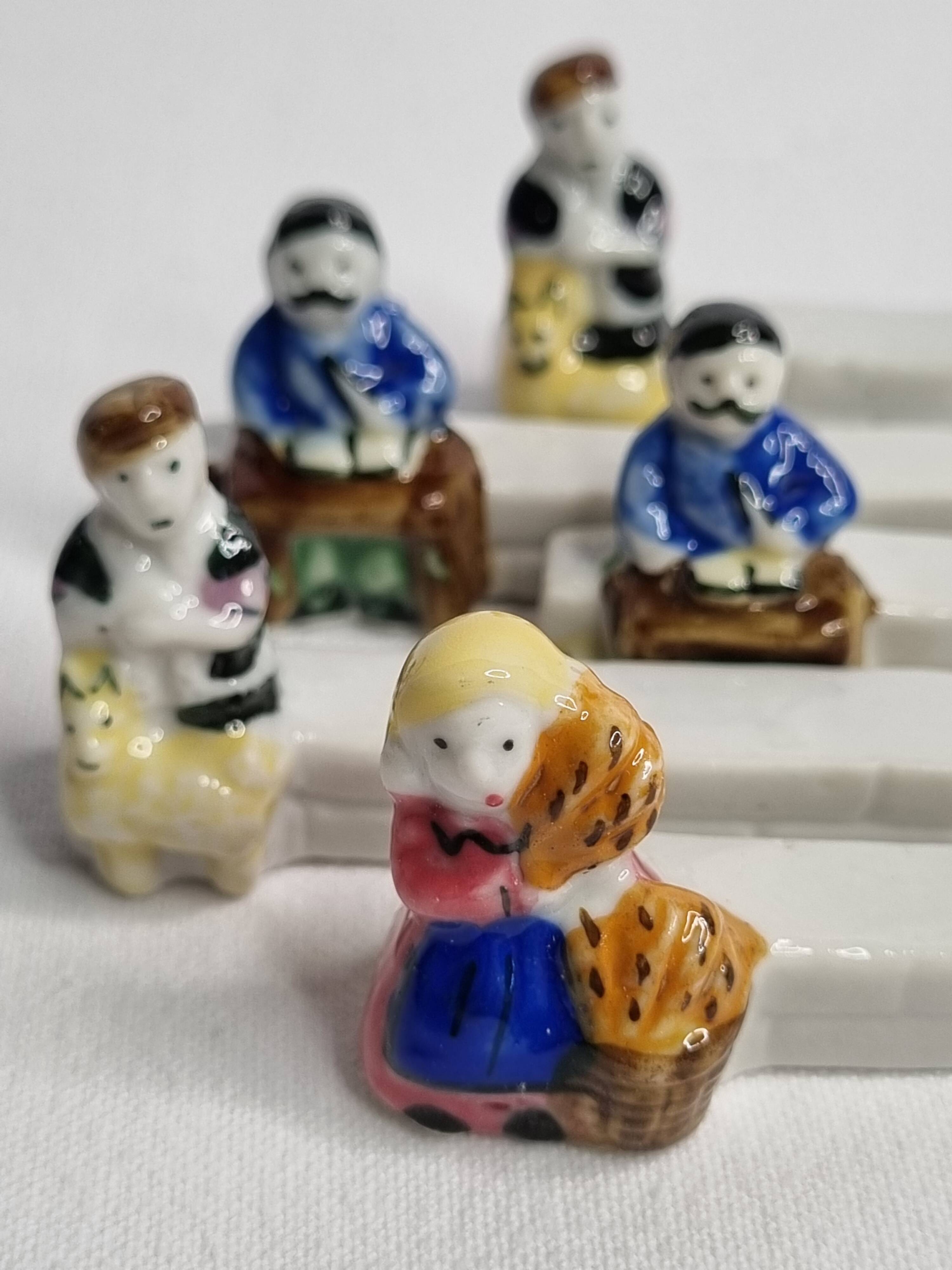 Five porcelain knife holders signed "Le Merzer", 6 cm