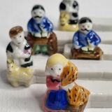 Five porcelain knife holders signed "Le Merzer", 6 cm