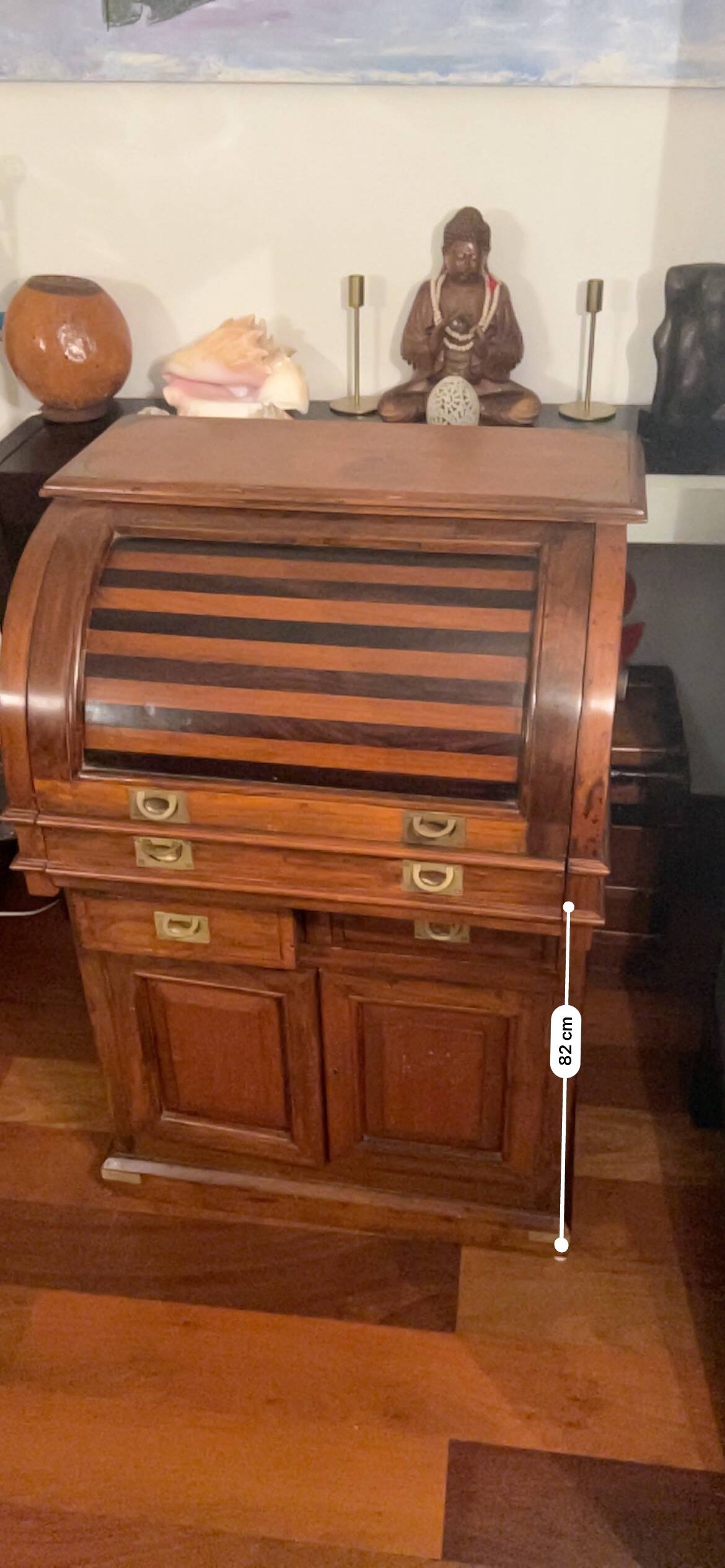 Antique solid wood secretary with a drop-down cylinder compartment.