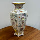 Porcelain vase with flower decorations by Dawen Wang.