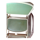 Old foldable stroller on metal wheels. Toy from the 50s