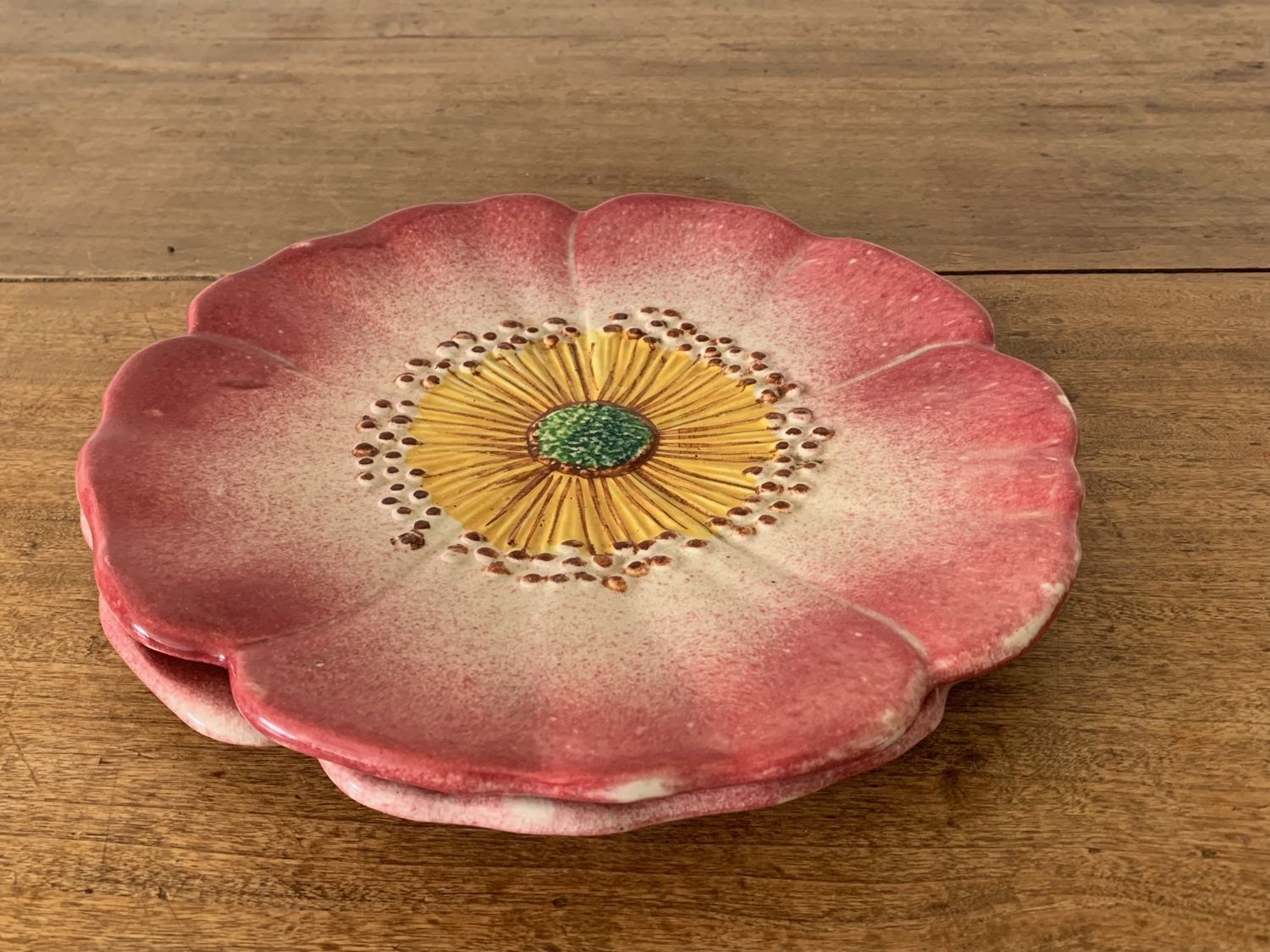 Two plates in slip by ceramist Delphin Massier