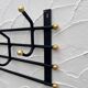 Iron and brass coat rack