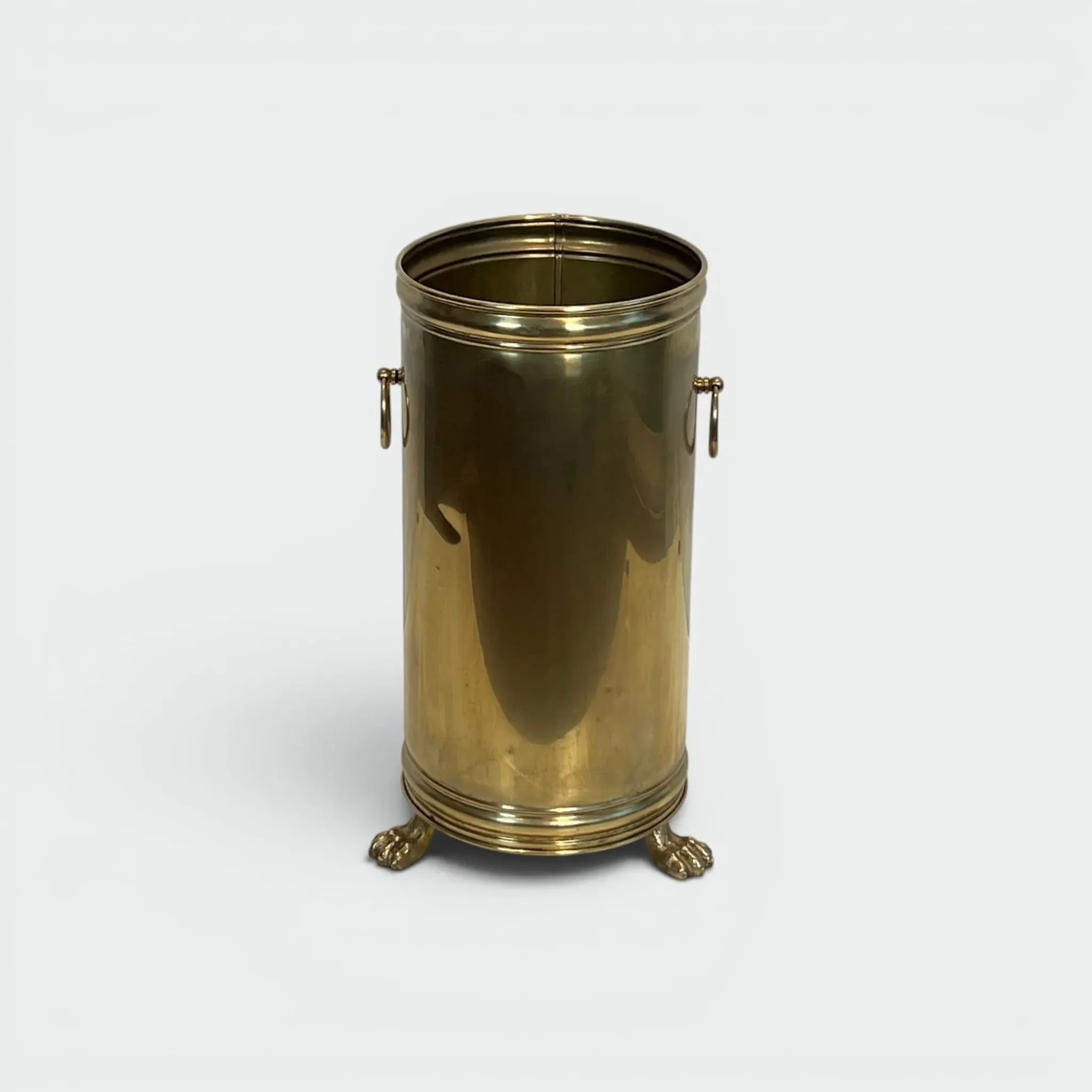 Cylindrical Brass Umbrella Stand with Ring Handles and Claw Feet.
