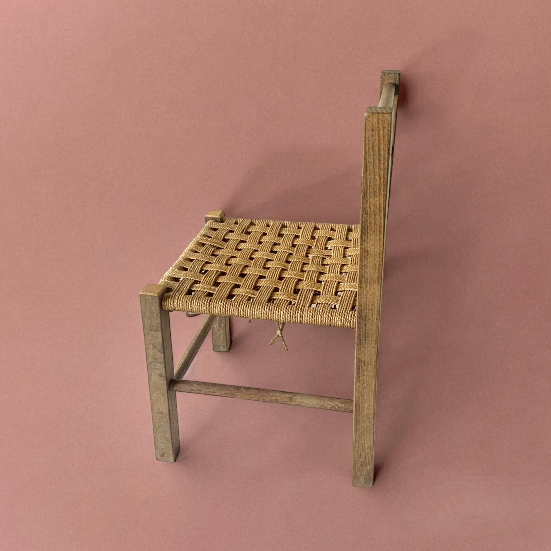 Vintage children's chair made of rope and wood