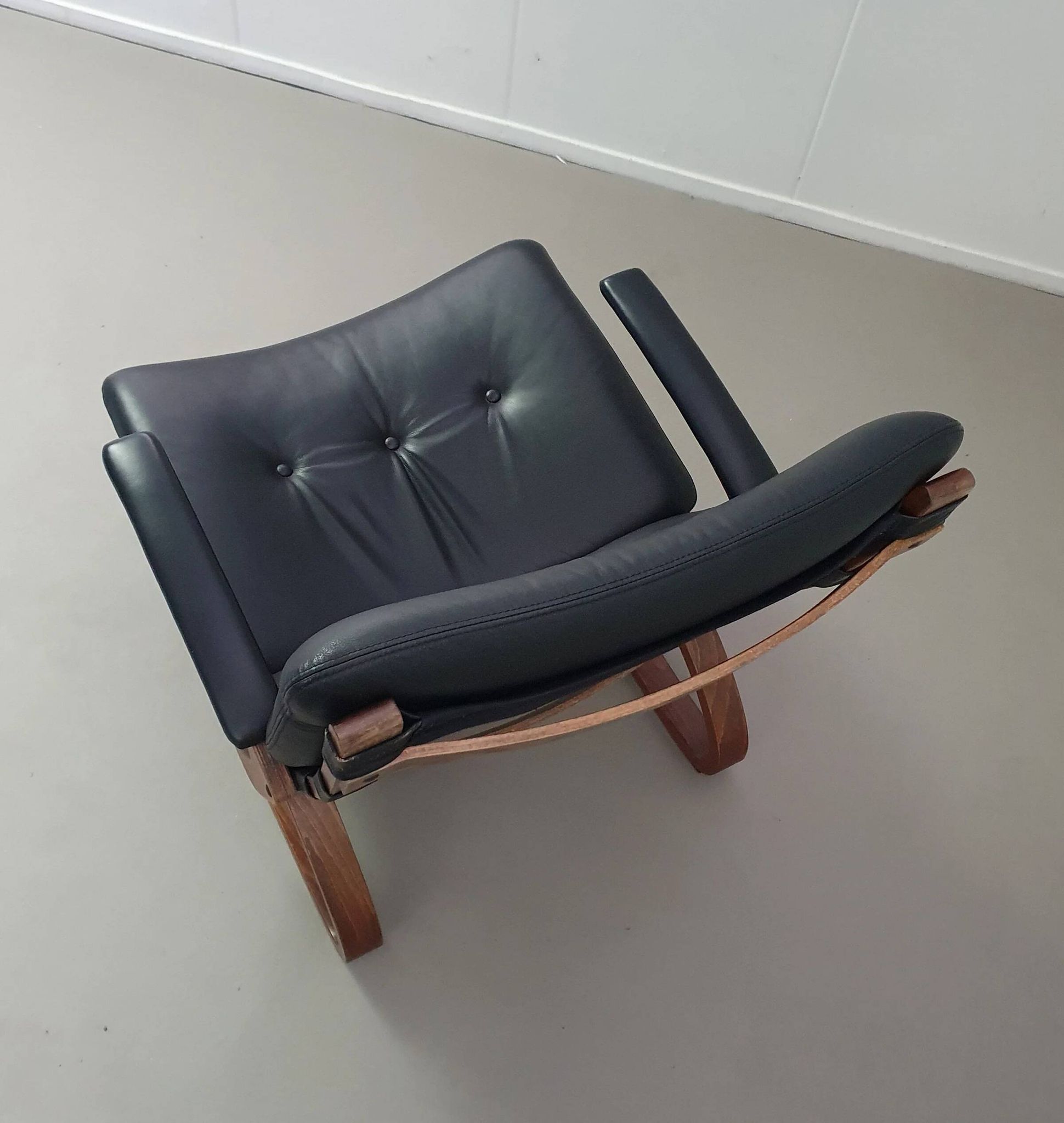 2 x Scandinavian black leather lounge chairs