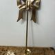 Solid brass bow and ribbon wall candle holder