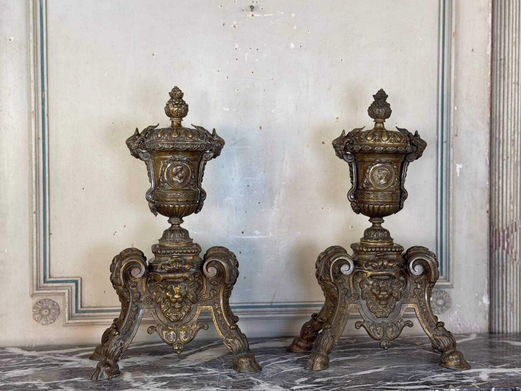 Pair of Louis XIV style andirons in bronze after a design by André-Charles Boulle.
