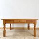 Antique coffee table in solid elm with turned legs.