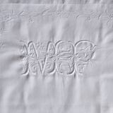 old pillowcase embroidered with fine flowers, marked MP, 19th