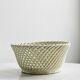 Bread basket - openwork white ceramic bowl.