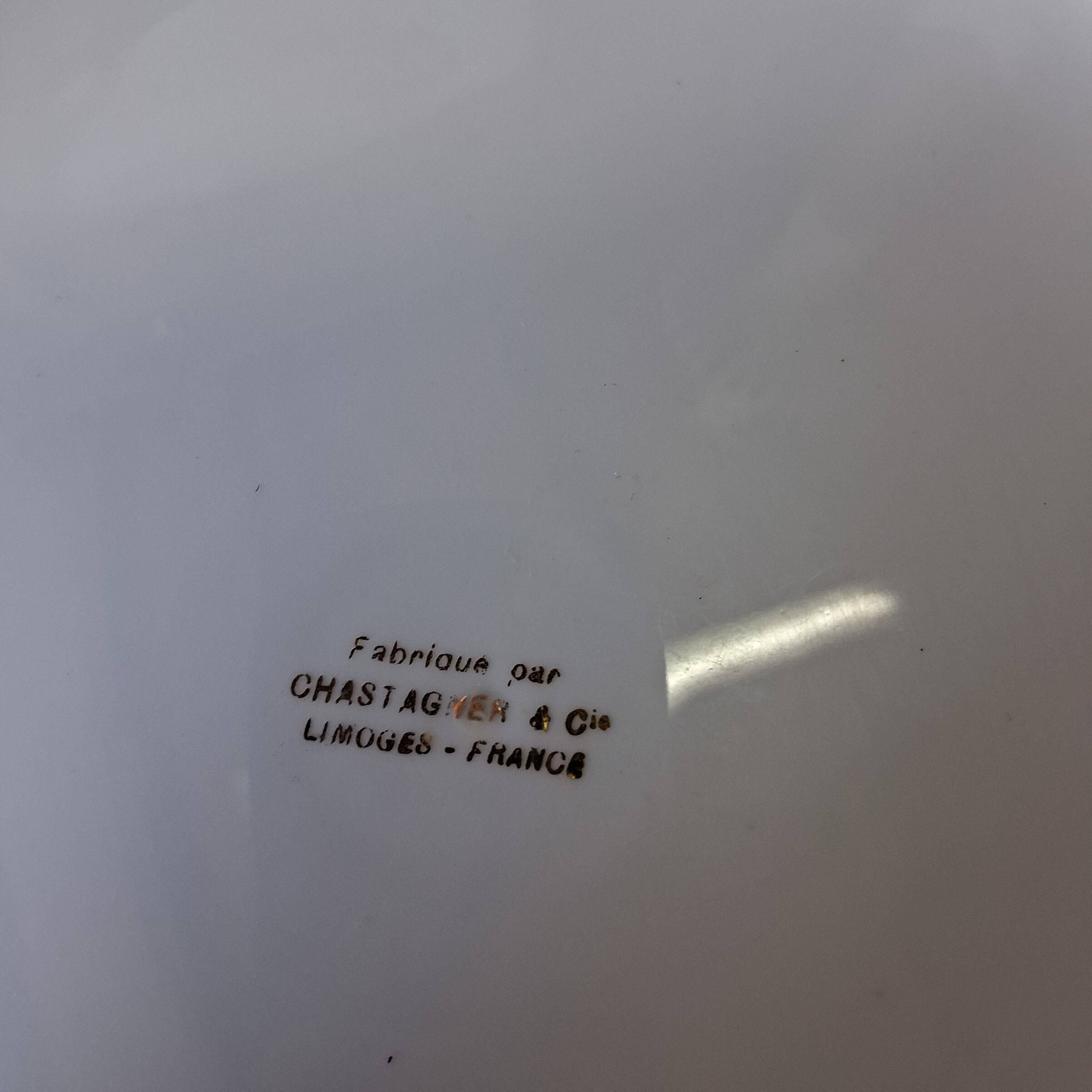 Round hollow serving plate in porcelain from Chastagner et Cie in good condition.