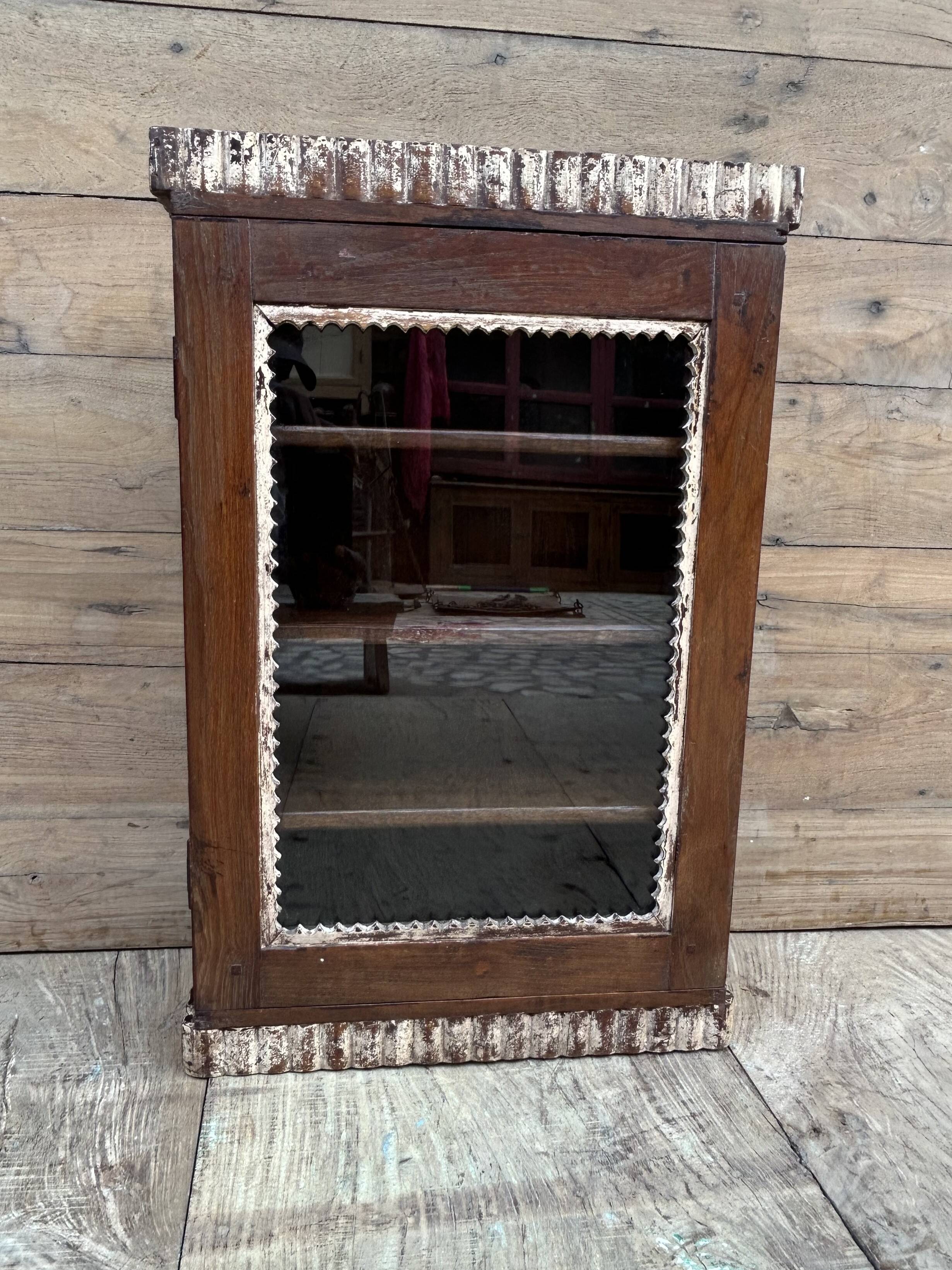Art Deco wall display cabinet in Burmese teak with original patina.