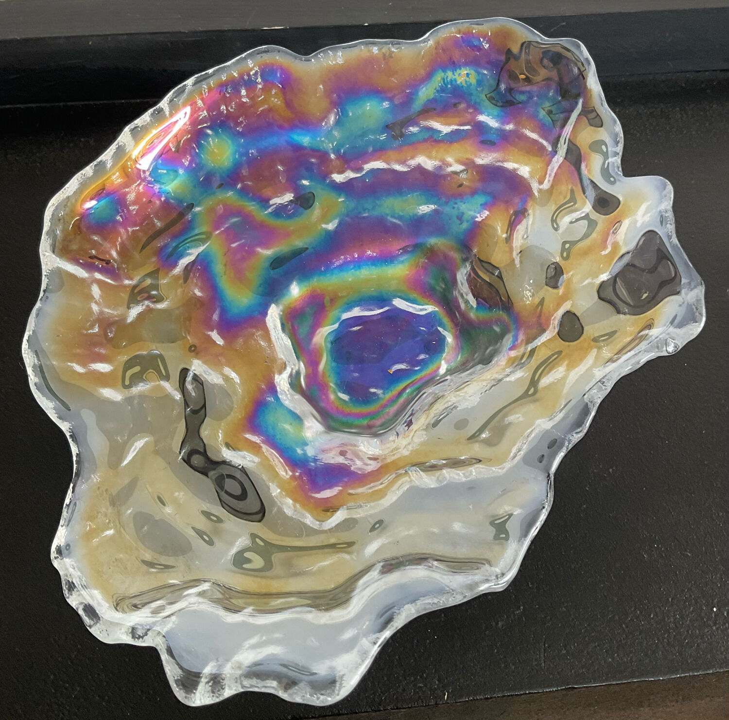 Empty vintage pocket in iridescent glass