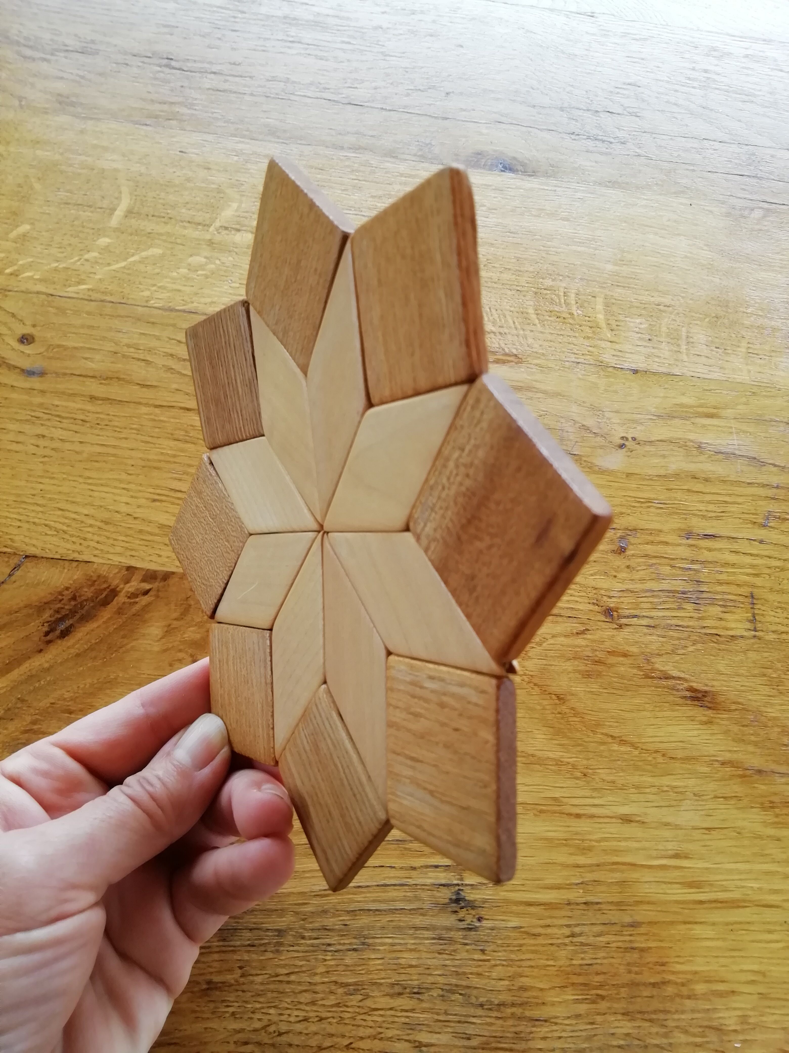 Under the geometric wooden plate