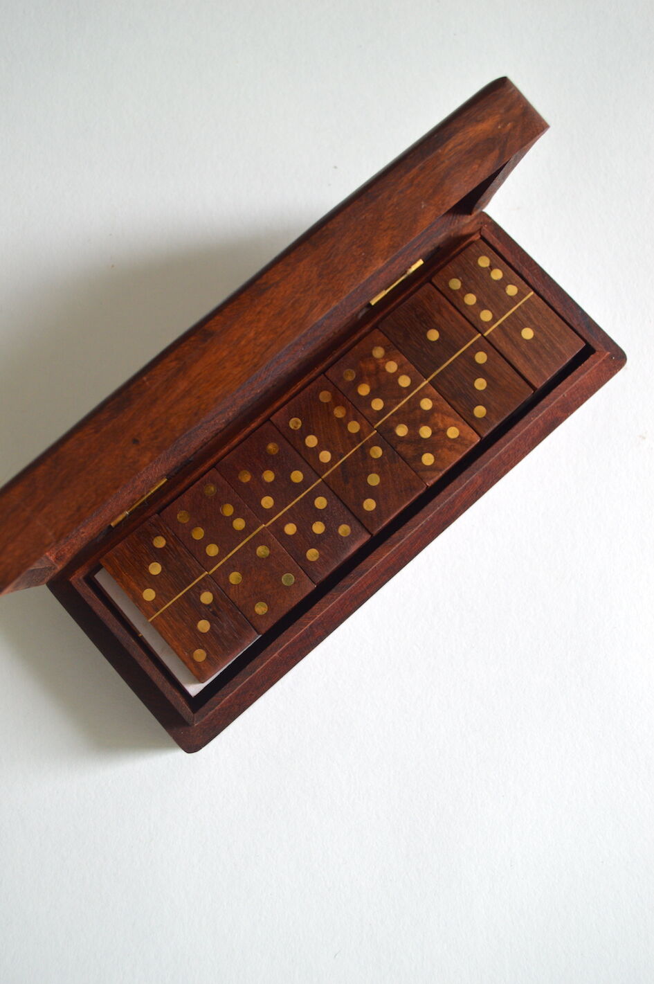 Box of brass and rosewood dominoes