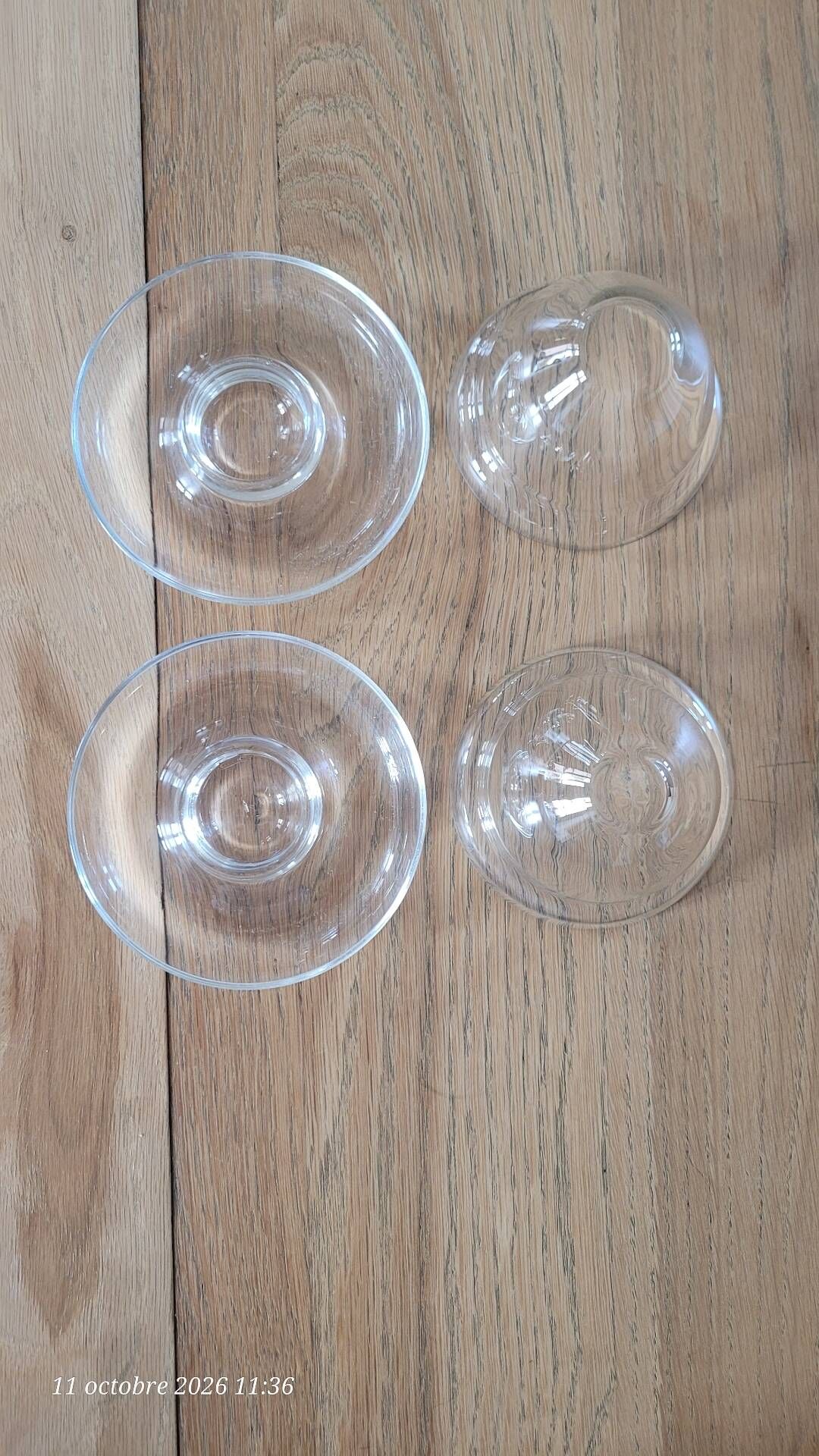 2 egg cups with matching glass cloches in transparent glass