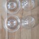 2 egg cups with matching glass cloches in transparent glass
