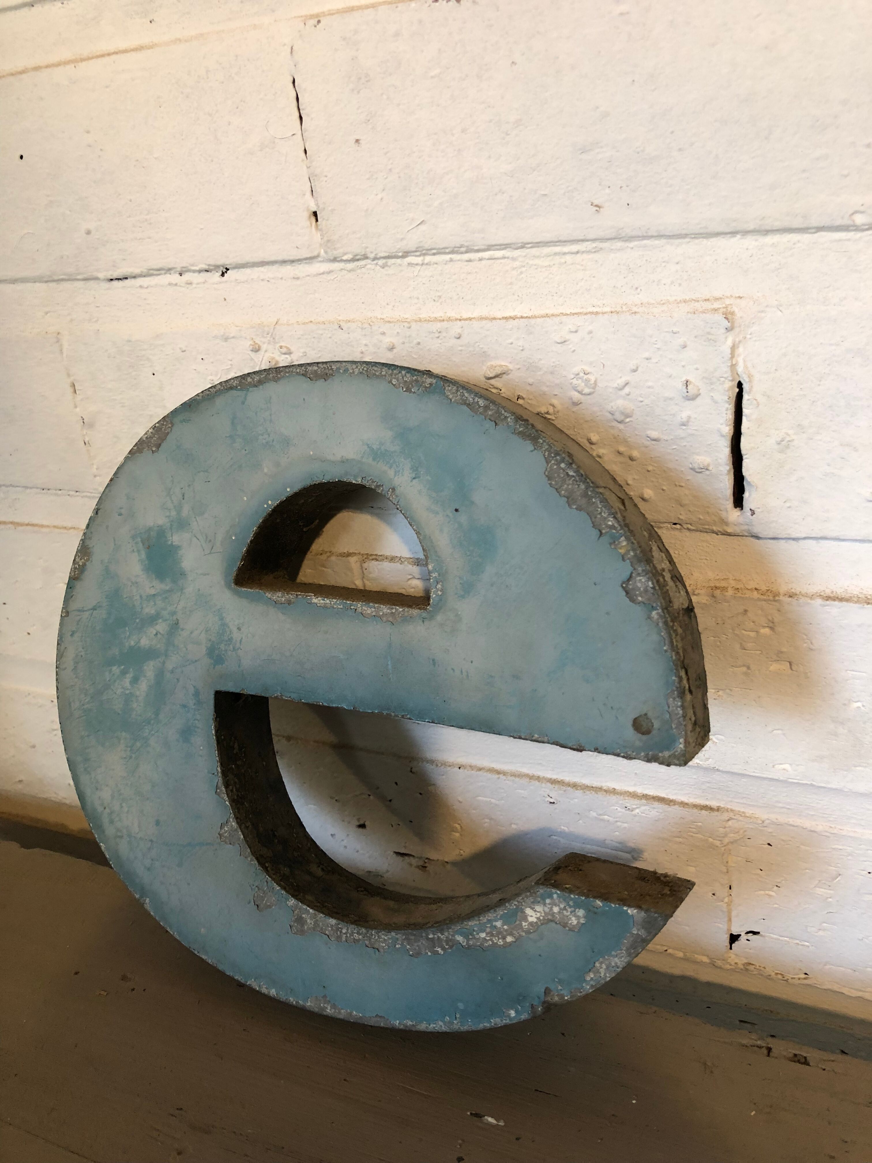 Blue sign letter "E"