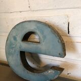 Blue sign letter "E"