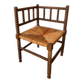 Corner armchair in beaded wood straw