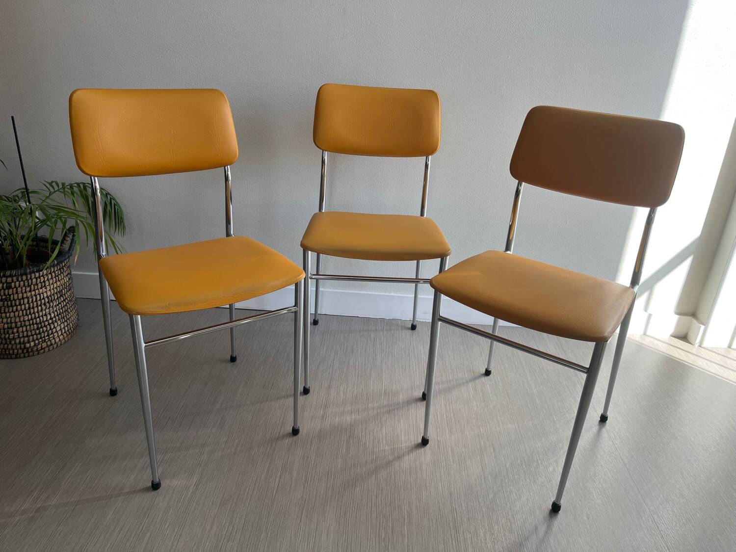 LM vintage chrome and orange/mustard yellow faux leather chairs