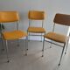 LM vintage chrome and orange/mustard yellow faux leather chairs