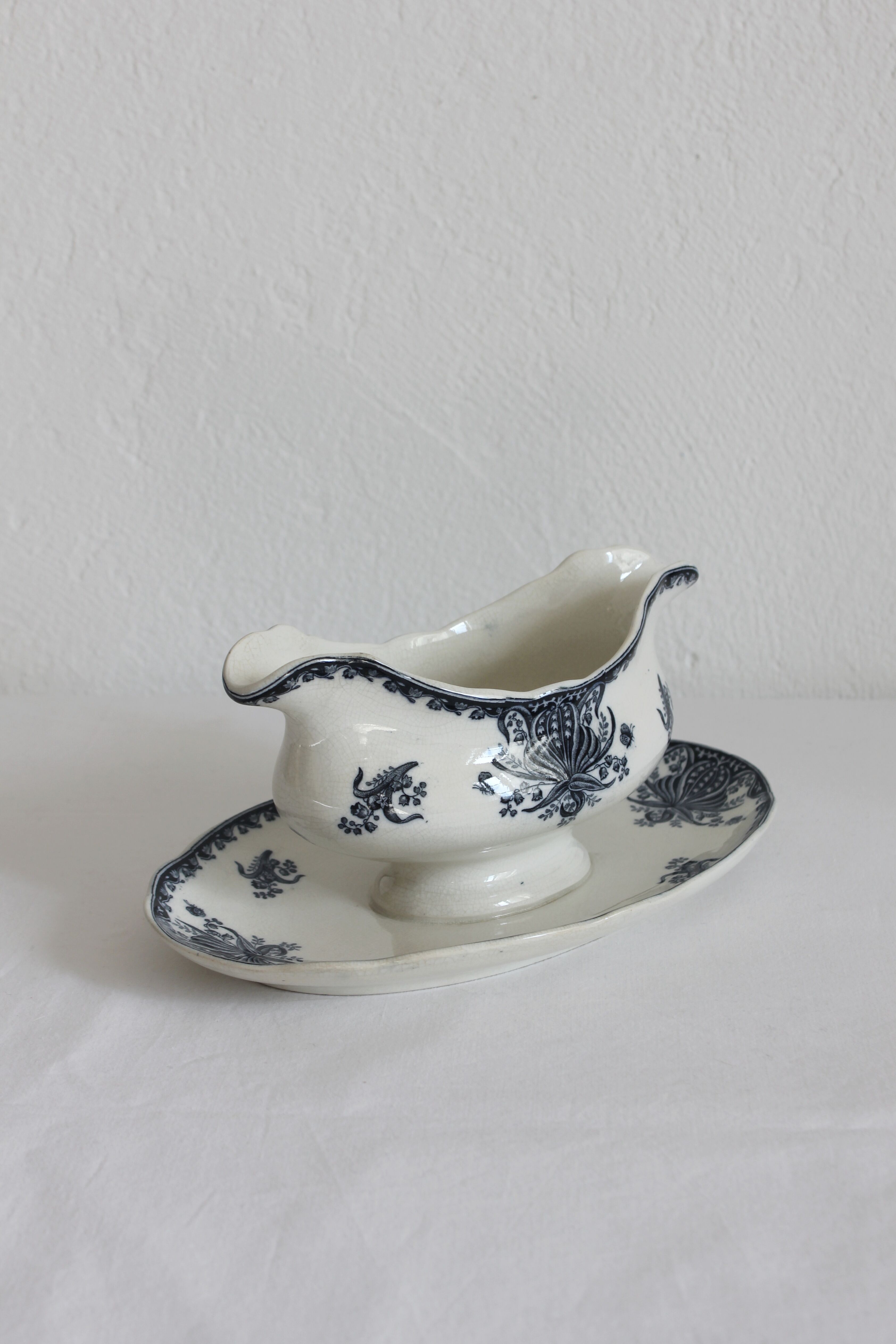 Ironware sauce boat with blue palmette decoration