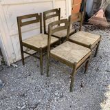 Set of 4 brown wooden dining chairs with straw seats, 1970s.