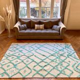 Berber cream carpet with blue pattern