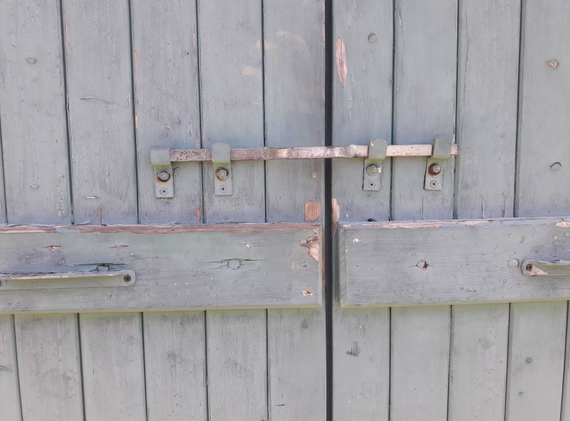 Pair of large wooden iron hanging shutters