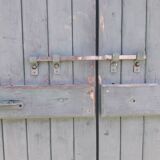 Pair of large wooden iron hanging shutters