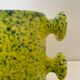 Handmade green speckled yellow ceramic vase with abstract handles