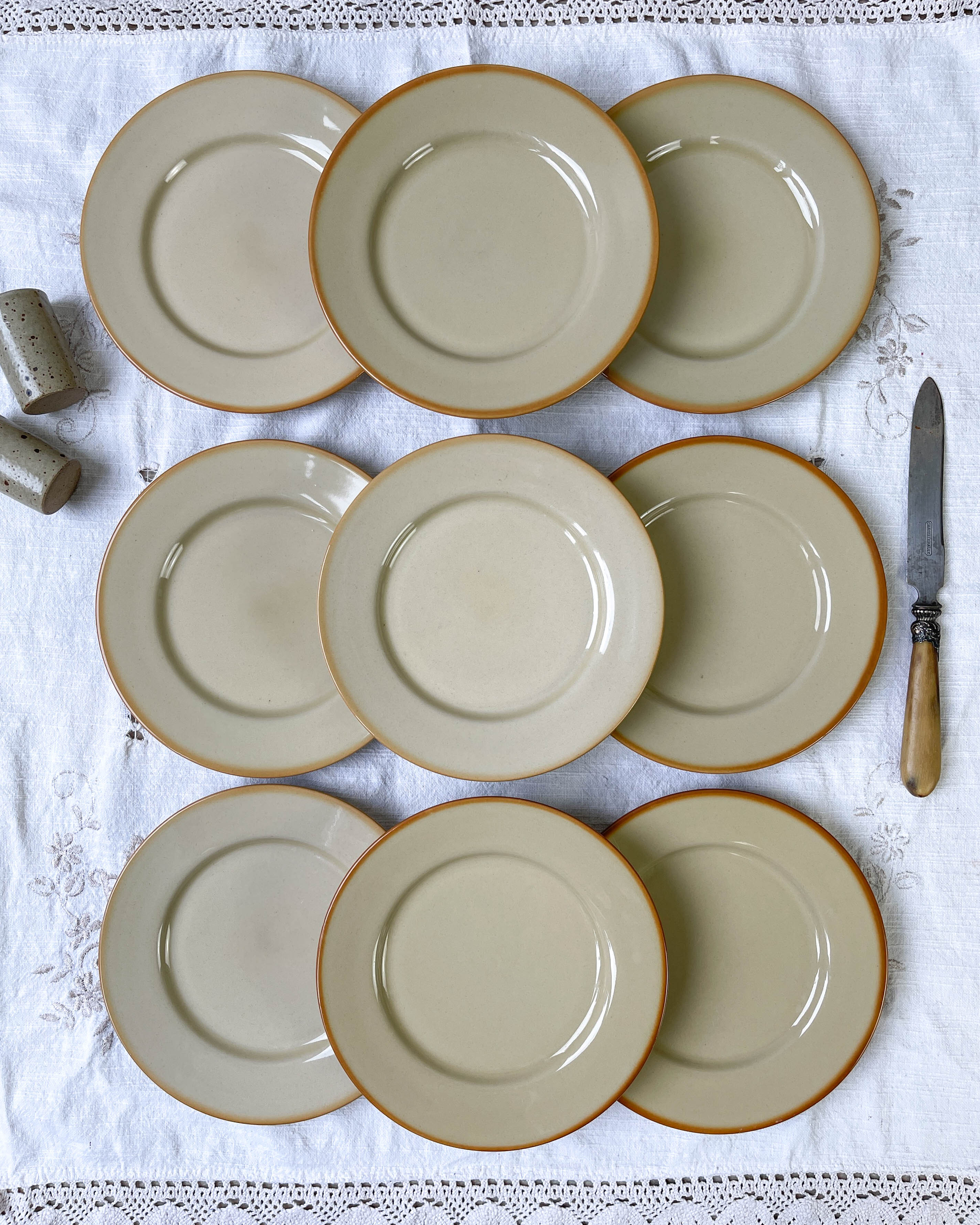 9 mid-century beige Tulowice stoneware plates