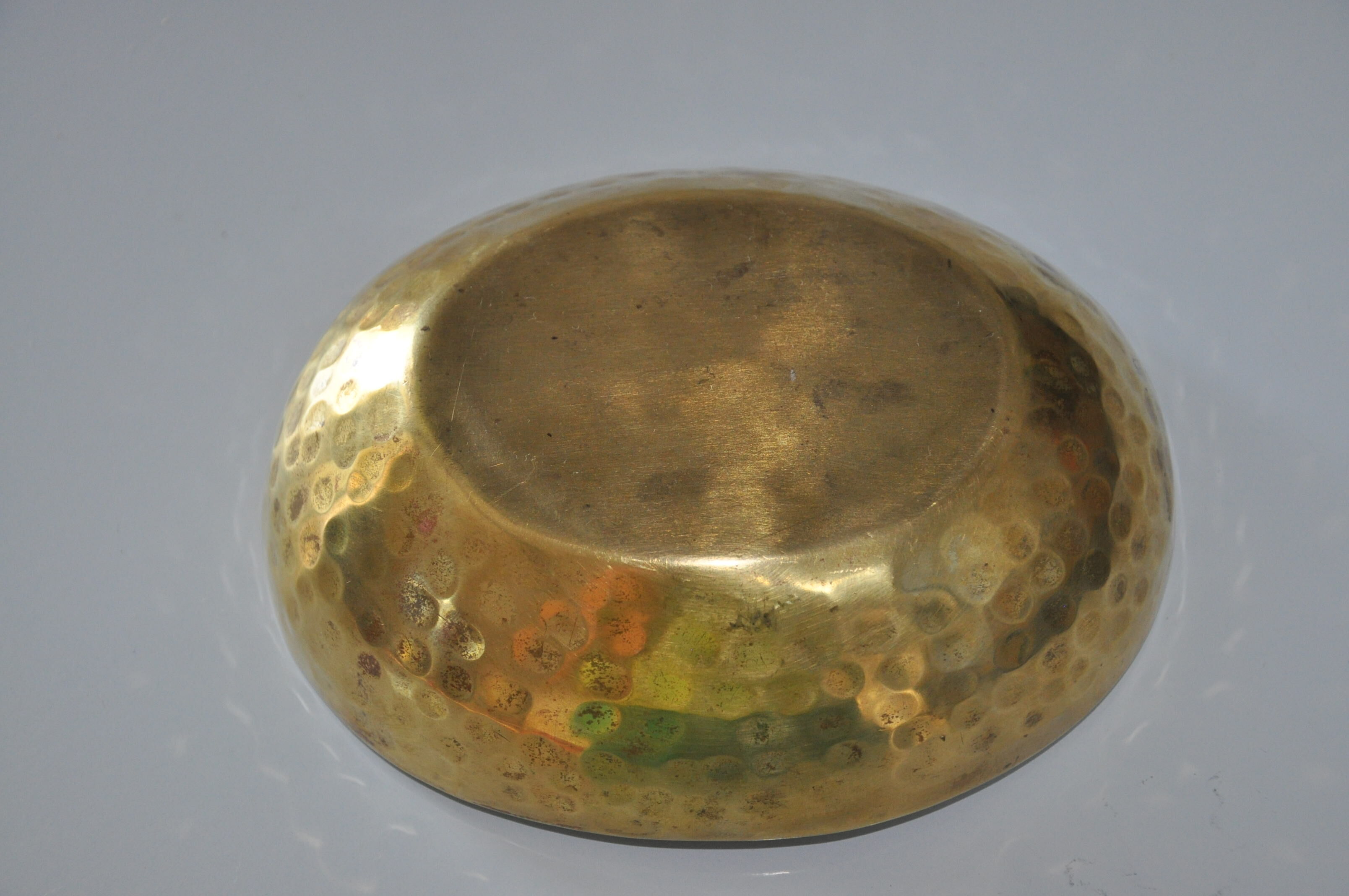 Empty hammered brass pocket