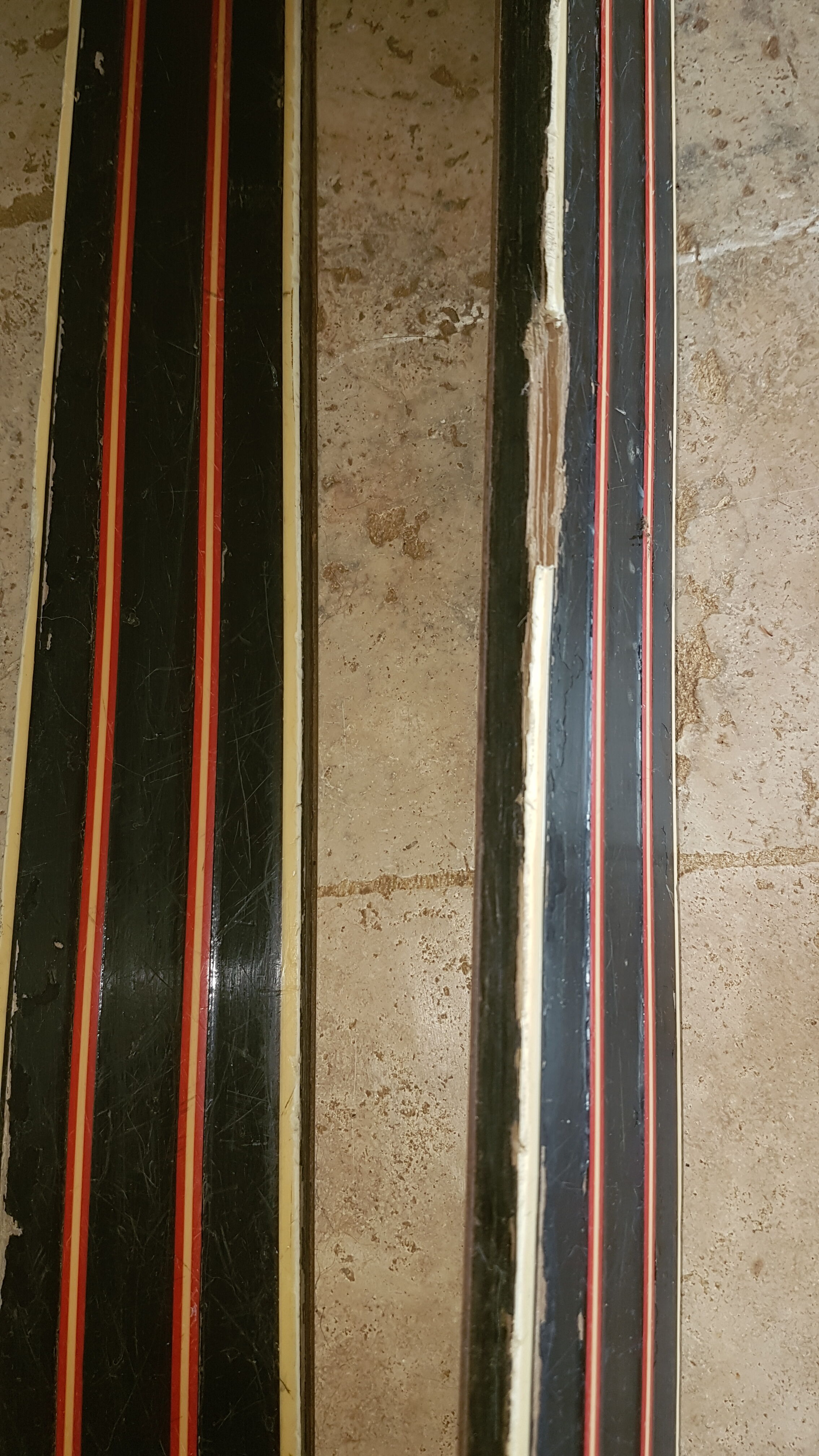 Old skis wooden and its pair of sticks