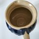 handcrafted ceramic jug with navy blue drip glaze.