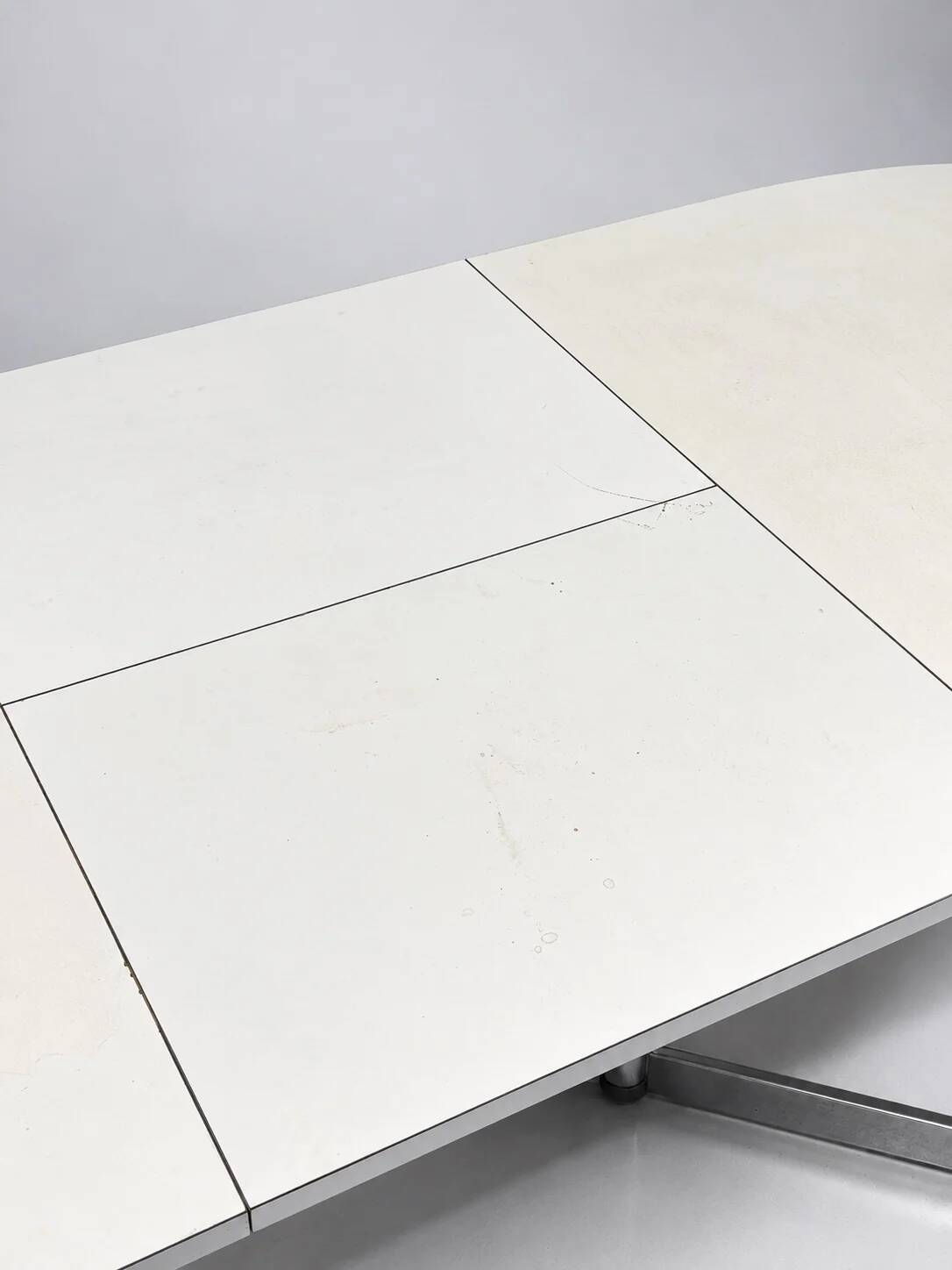 Vintage oval extendable dining table, white laminate and chrome, 1970s.