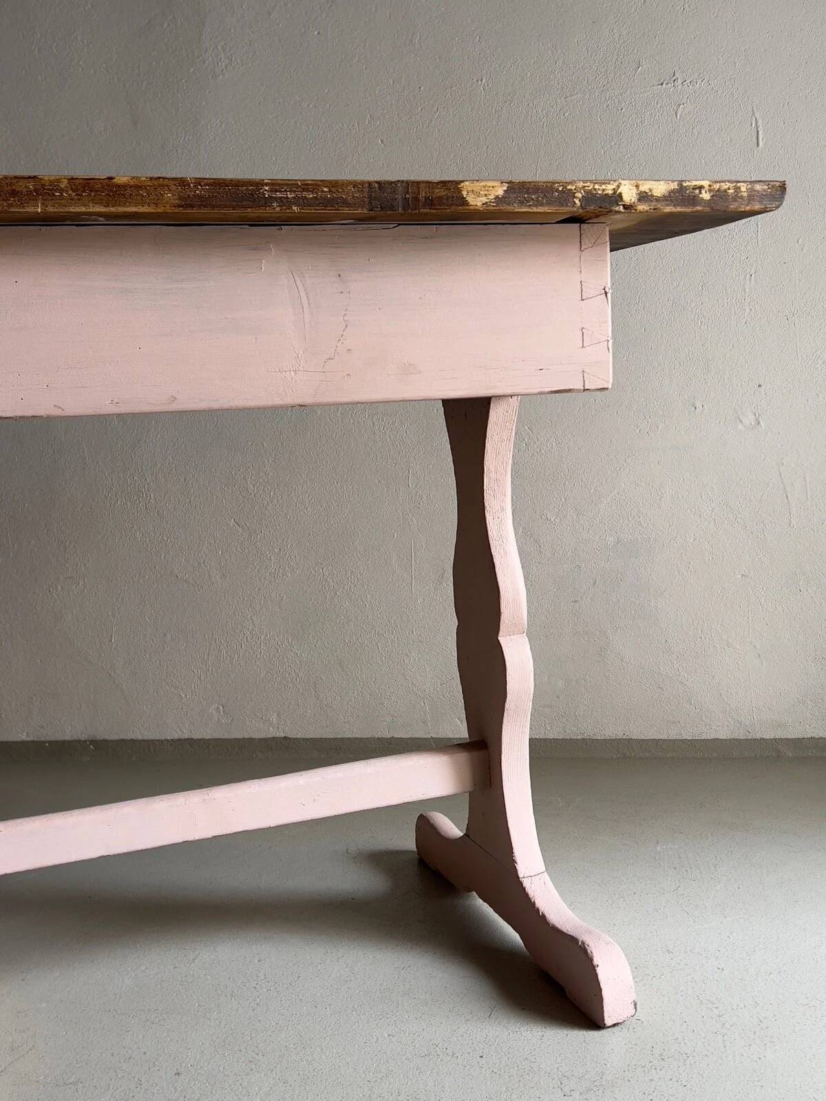 Rustic pink painted desk with brown tabletop
