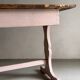 Rustic pink painted desk with brown tabletop