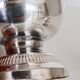 Silver-plated sugar shaker with fluted edges