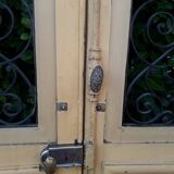 Porte d'entrée cintrée double en chêne, grilles et verre, XIXème