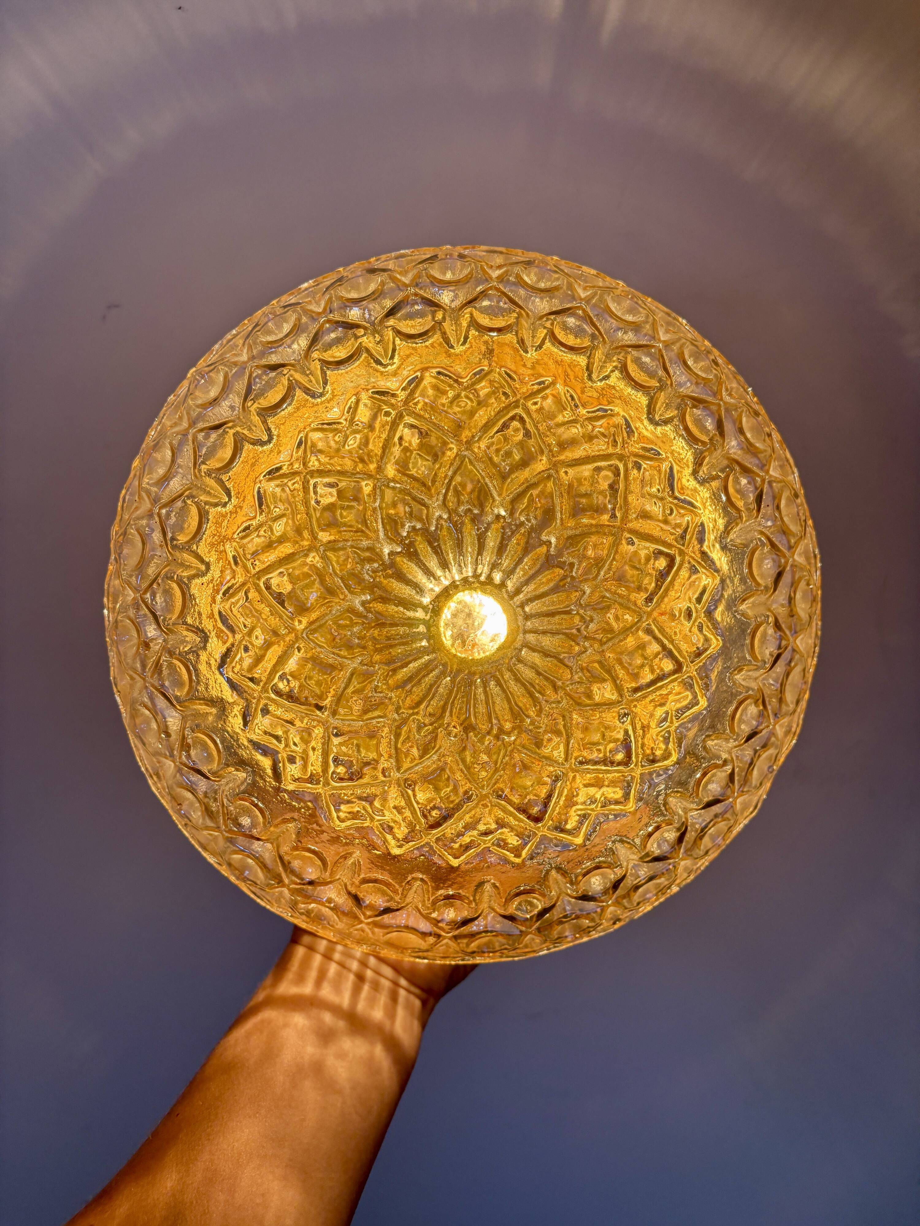 Vintage amber glass globe wall/ceiling light.