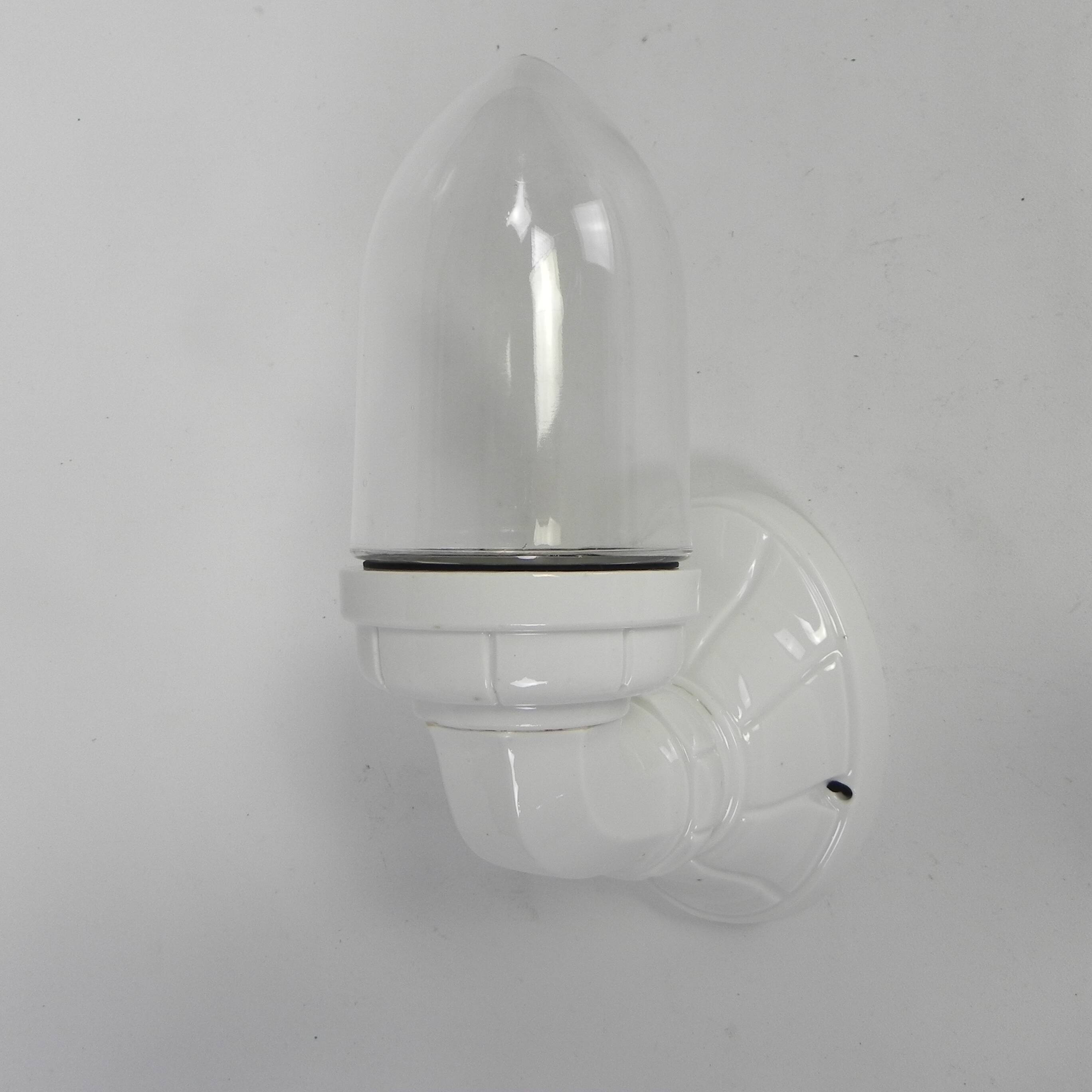 Wall lamp in porcelain with a transparent glass shade, 1930s.