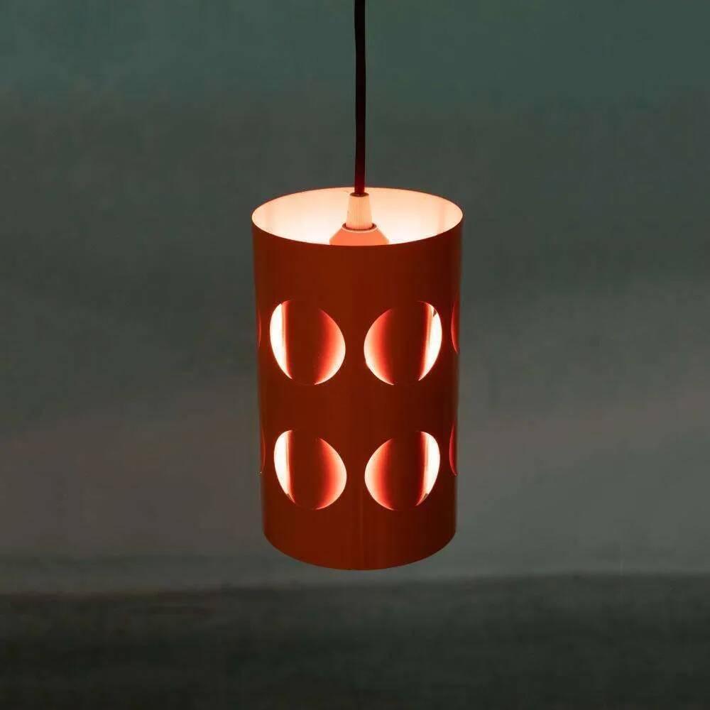 Vintage orange suspension light in a 1970s space age style.