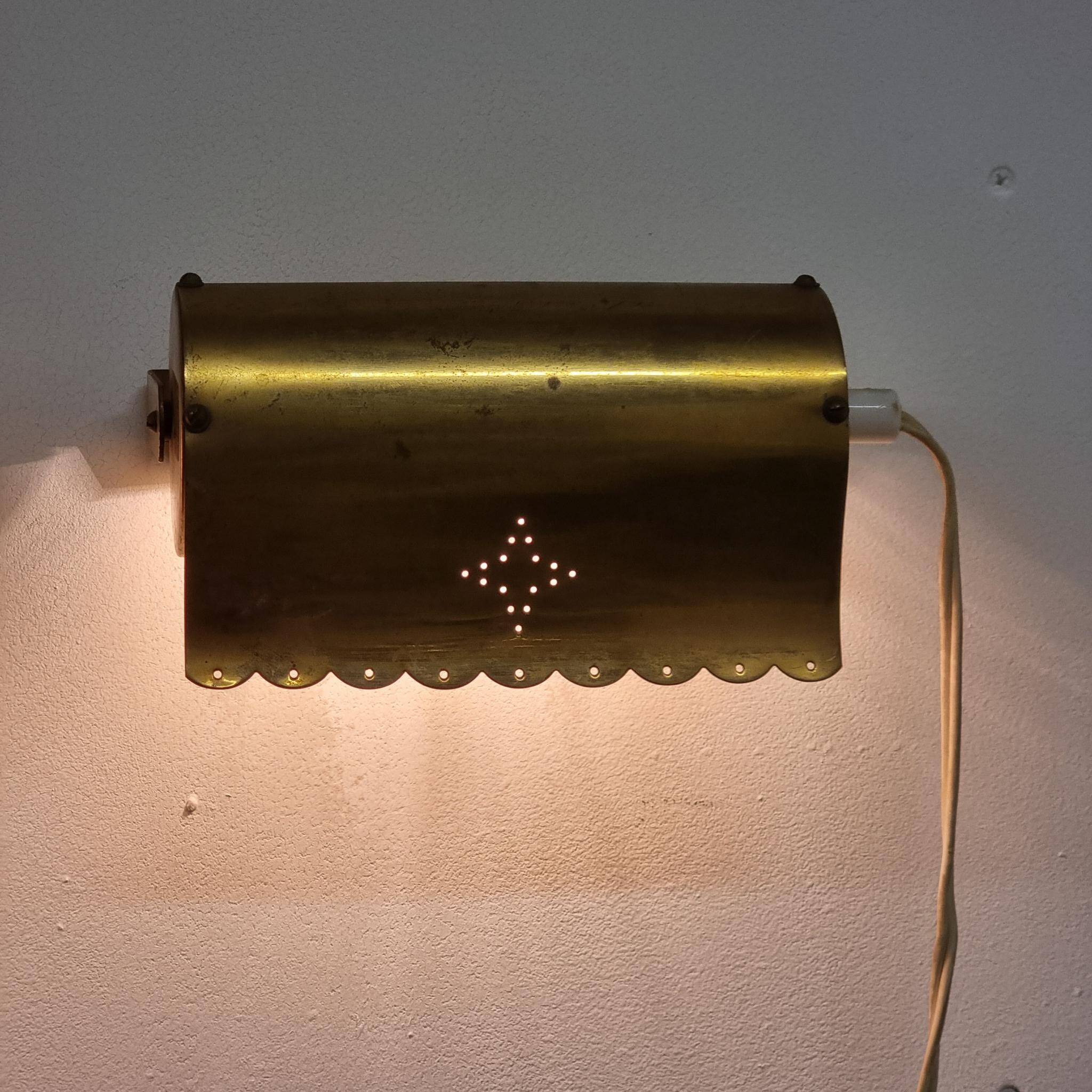 A pair of charming wall sconces/branches in brass with a star pattern, modern Scandinavian style.